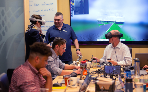 VHBers wearing virtual reality headsets testing the Model-Based Design programs.