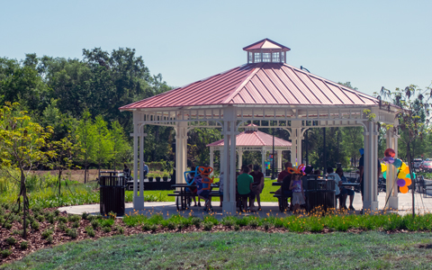 A picnic pavilion near vegetation at a park