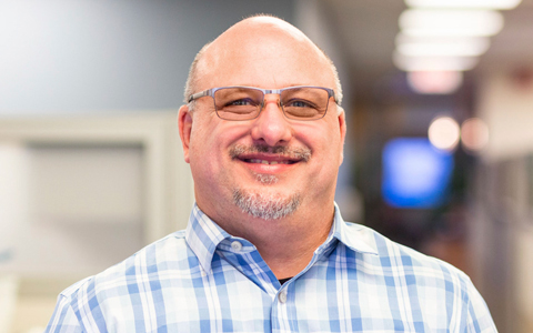 Frank Koczalka smiling at the camera.