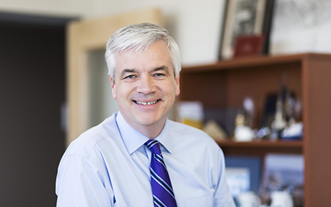 VHB President and CEO Mike Carragher in his office smiling