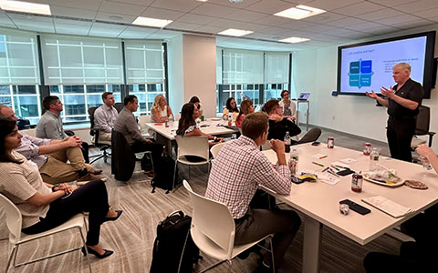 Participants sitting watching a presentation