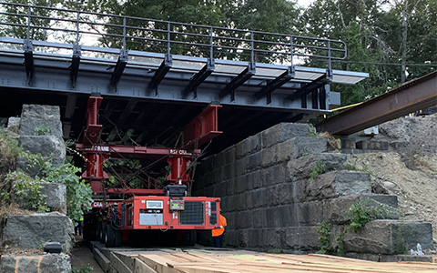 Rapid installation of bridge carrying MBTA Commuter Rail line.
