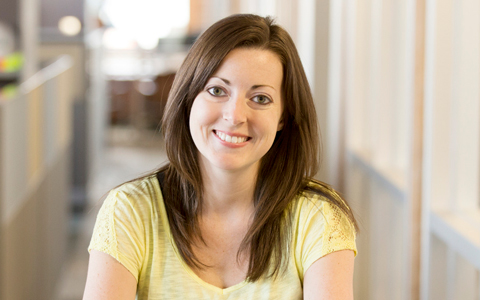 Rachel Dooley poses in an office.