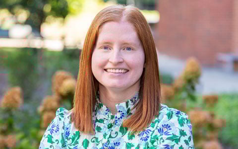 Elizabeth Phelps smiles at the camera.