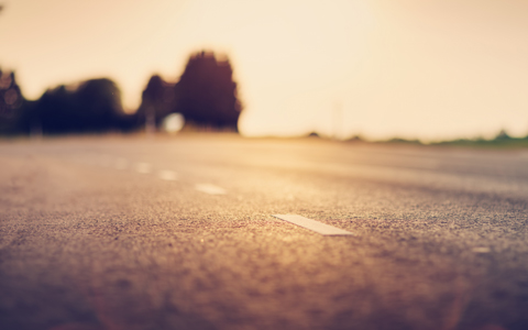 black asphalt road and white dividing lines