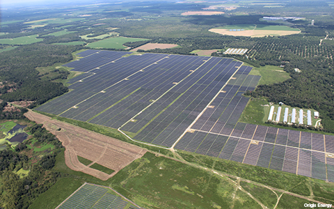 A solar farm stretches across formal rural agricultural land in Georgia, providing clean, renewable energy to thousands of area homes.