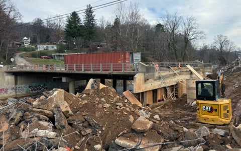 Repair efforts underway at a bridge impacted by Hurricane Helene. 
