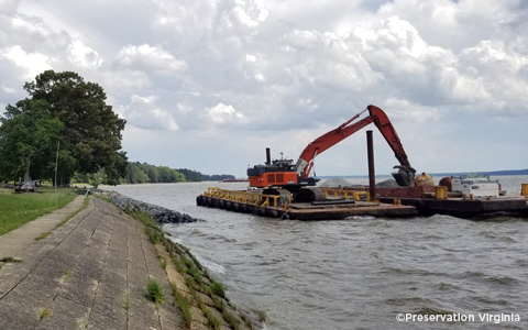 Construction equipment in the water for the seawall repair project at historic Jamestown.