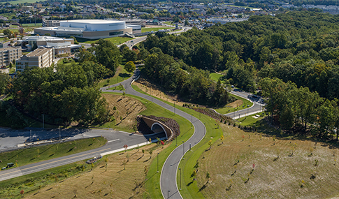 Aerial view of the completed JMU Land Bridge and tunnel, and multi-modal pathway