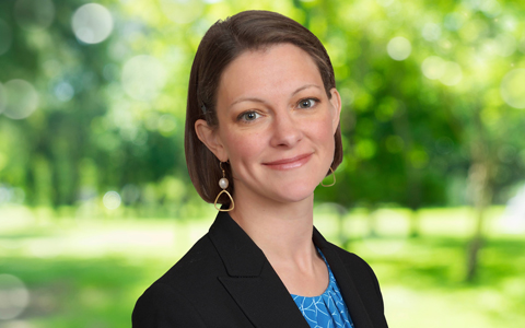 Kate Lindekugel wears a blazer outside.