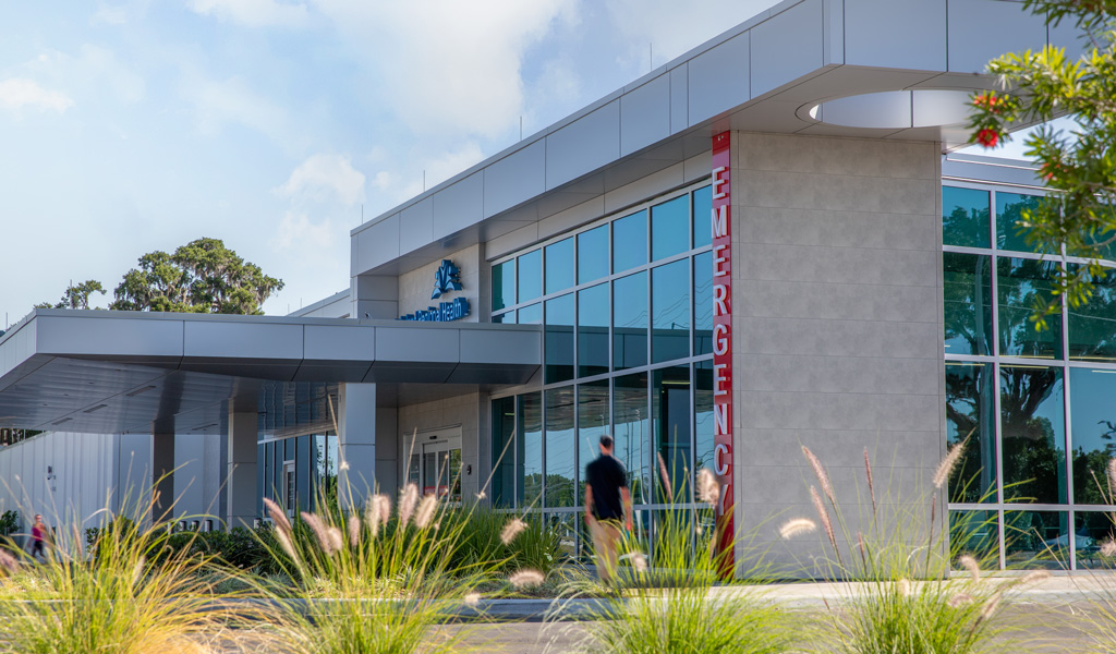 An emergency department with native plants in front.