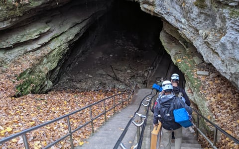 The Archaeology Team descending toward the historic cave entrance.