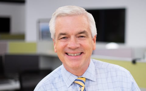 Mike Carragher smiling at the camera.