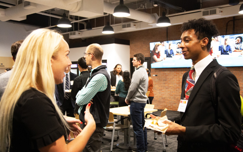 VHB employees and Northeastern alums mingle with NU students at a VHB open house.