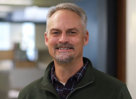 Prentiss Lund smiles at the camera.