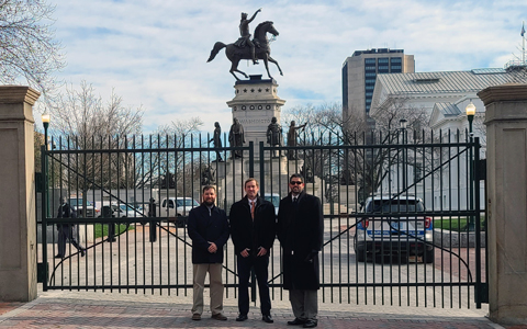 Members of the project team stand in front of the newly constructed Virginia State Capitol security gate.