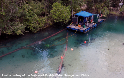 A boat with equipment for sedimentation surveys on a river.