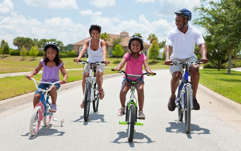 African American Family Parents and Children Cycling
