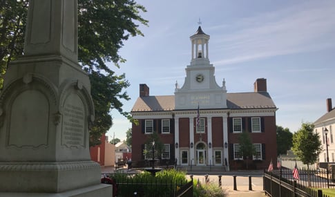 A view of City Hall in downtown Westborough, Massachusetts, beside an historic memorial statue