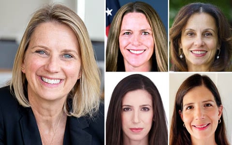 Five women smiling at the camera.