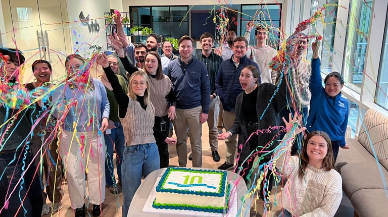 Group of VHBers celebrating with cake and confetti.