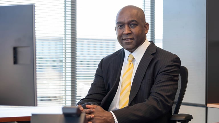 Reggie Scales smiles at the camera. 