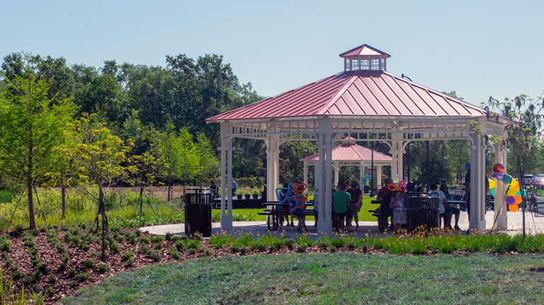 A picnic pavilion near vegetation at a park