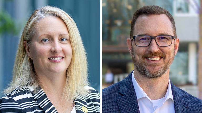 Regan Hammond and Jay Jenkins smiling at the camera.