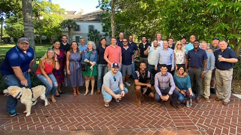 VHB Orlando employees safely gather outside for a social event