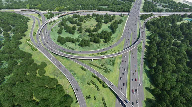 Cars driving on a model of a highway with overpasses.