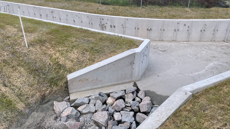 Completed concrete stream channel as part of the new Burton Station infrastructure to mitigate flooding.