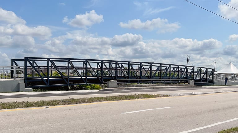 A pedestrian bridge near a busy roadway