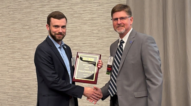 Charlie Townsend shakes hands with PENC President, Brian Johnson. 