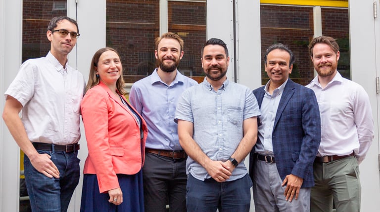 VHB team members smile together for a group photo.