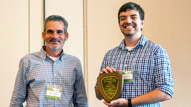 Chuck Conran accepts award at the VASITE annual meeting 2025.
