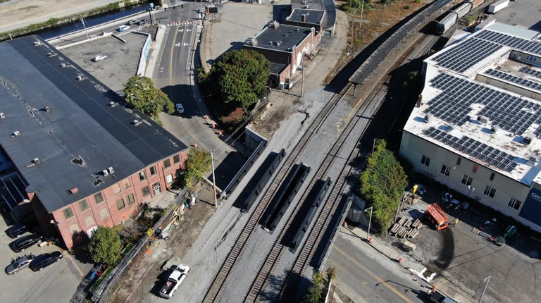 Aerial view of a railway yard with several train tracks and a few trains.  