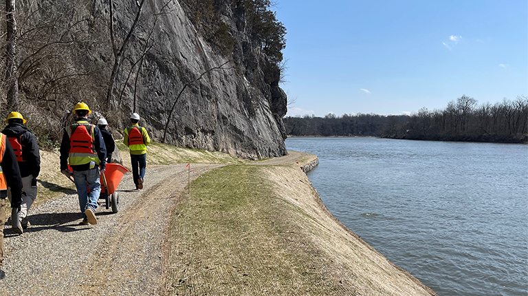 The project team takes a final walk through along the towpath. 