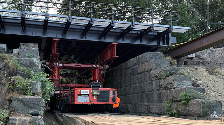 Rapid installation of bridge carrying MBTA Commuter Rail line.
