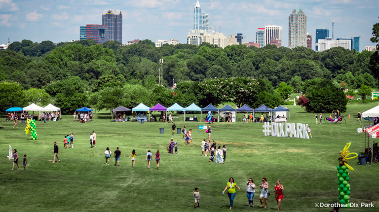 SunFest Festival at Dix Park with the Raleigh Skyline in the distance