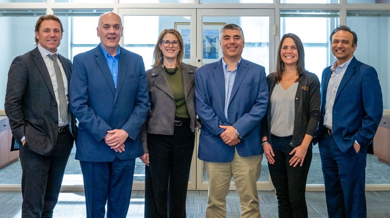 Group of VHB and Drive employees smiling together.