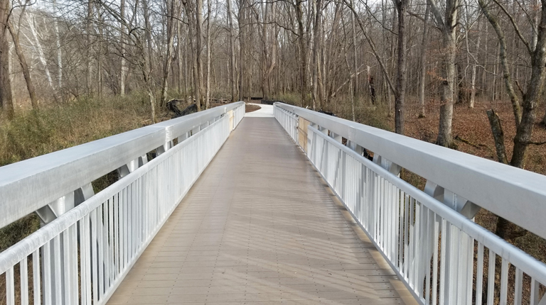 : View of the accessible trail that connects to the newly constructed pedestrian bridge.