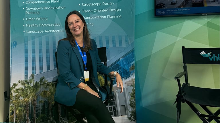 Roberta Fennessy smiles at a VHB conference booth.