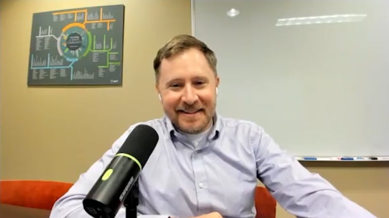 Kyle Rosenmeyer smiles in an outdoor office setting.