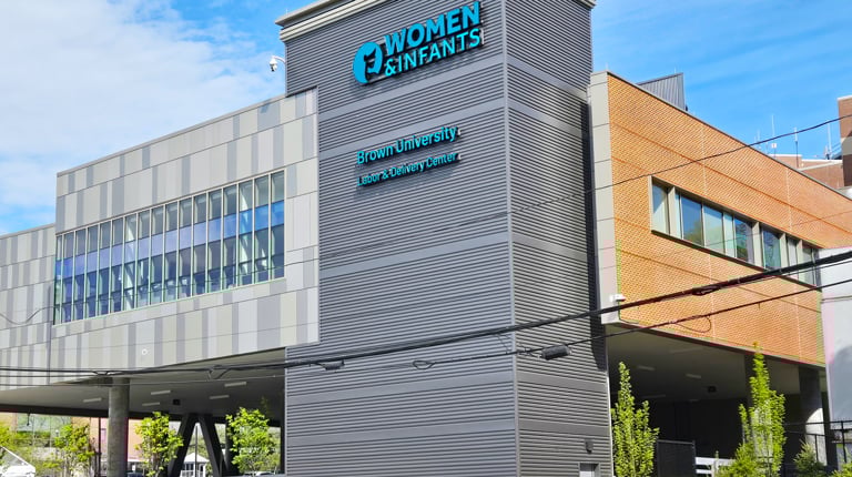 Glass and brick building with Women and Infants sign.