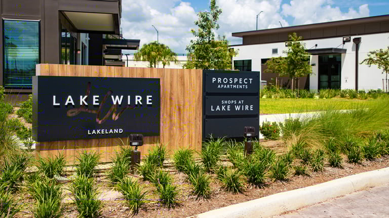 Signs in front of the Prospect Apartments in Lake Wire.