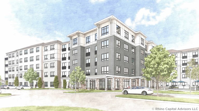 Architectural rendering of a modern multi-story apartment building with landscaped surroundings and parked cars.