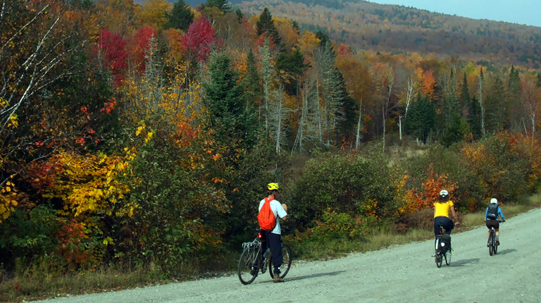 Bicyclists on gravel bike paths in Bethel, Maine.