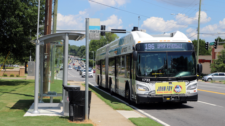 A MARTA bus at a bus stop in Clayton County.