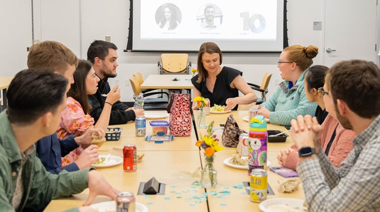 Employees gathered at a VHB Milestones celebration recognizing service anniversaries.