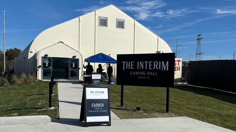 An exterior image of a temporary gaming hall, a white tent-like structure, in Norfolk. 